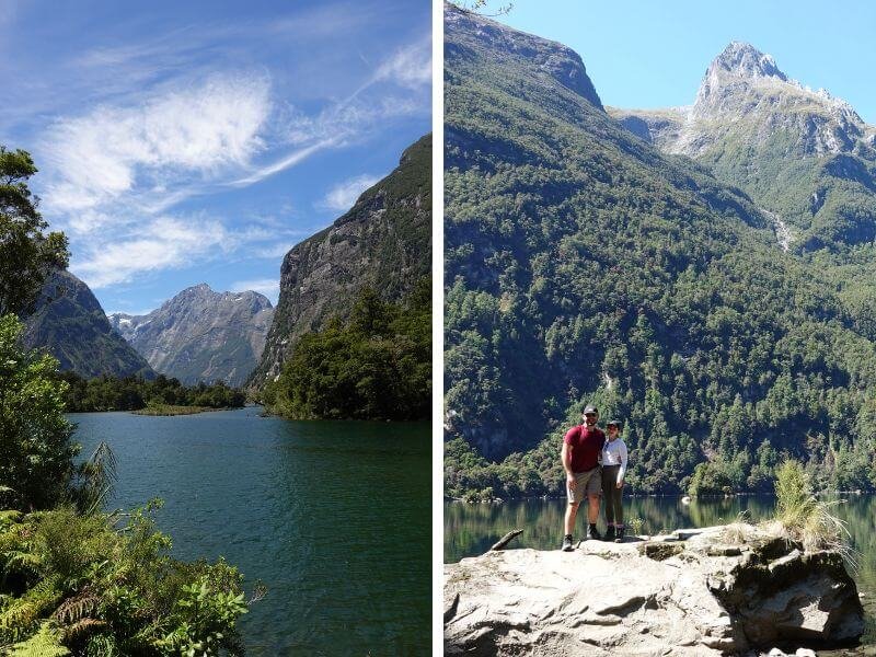 Split image showing scenic views from the Milford Track day hike in Milford Sounds. On the left, a calm river winds between forested mountains under a bright blue sky. On the right, two hikers stand on a rock ledge with towering green peaks and a clear lake behind them.